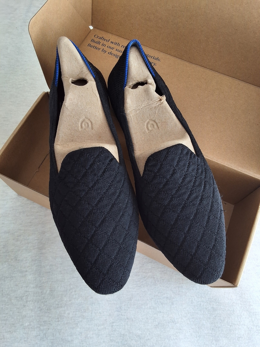 Rothy's Black Quilted Slip-On Flats with Blue Edge